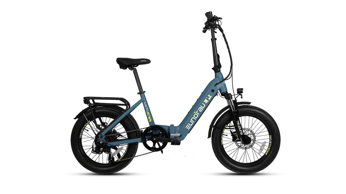 Side view of a blue Eunorau META20 folding electric bike against a plain white background. The e-bike features a low step-through frame, a front suspension fork, a rear cargo rack, and thick tires.