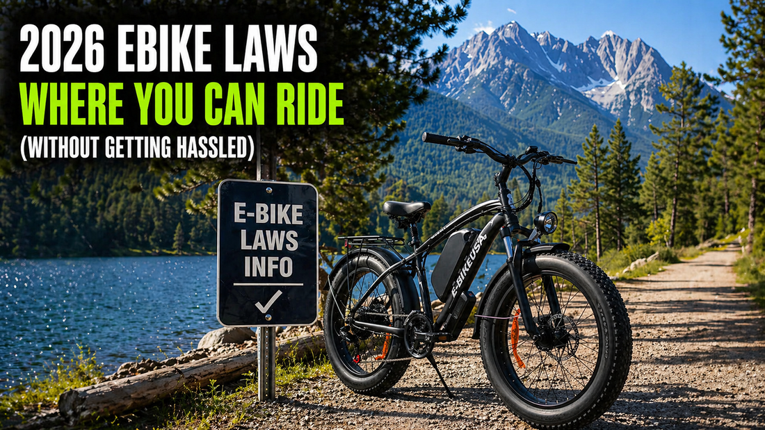 Electric bike parked by a lakeside trail with mountain backdrop and sign highlighting 2026 e-bike riding laws.