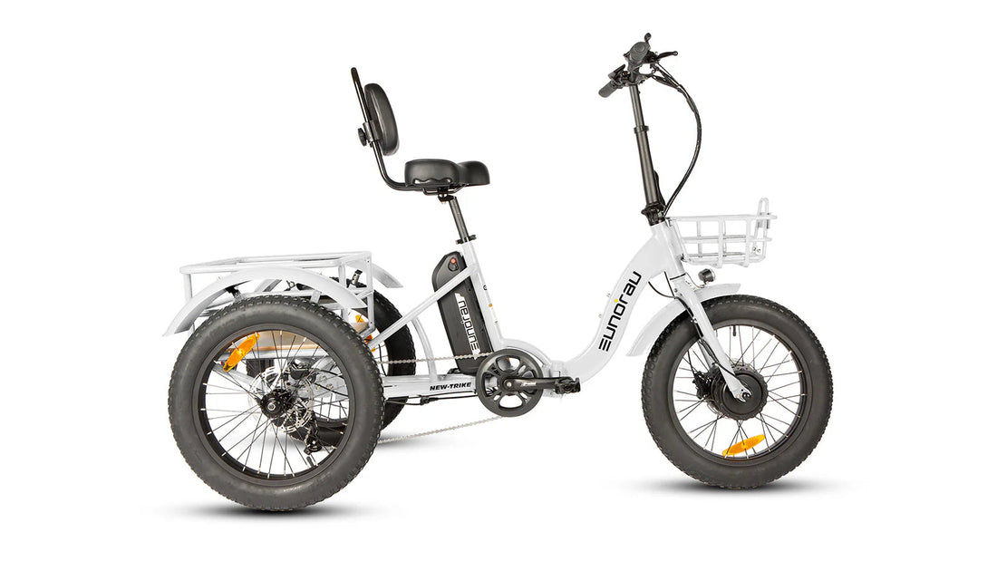 White electric tricycle with black wheels and basket on a white background.
