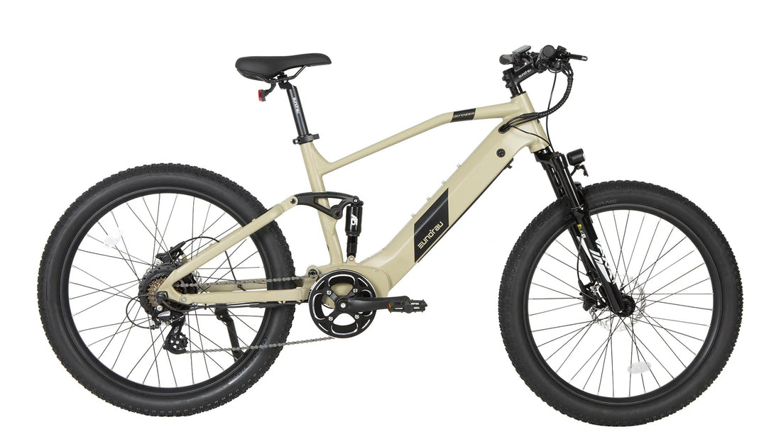 Side view of the Eunorau DEFENDER full-suspension electric mountain bike in a matte tan color, featuring a rear hub motor, integrated downtube battery, front suspension fork, and rear air shock against a white background.
